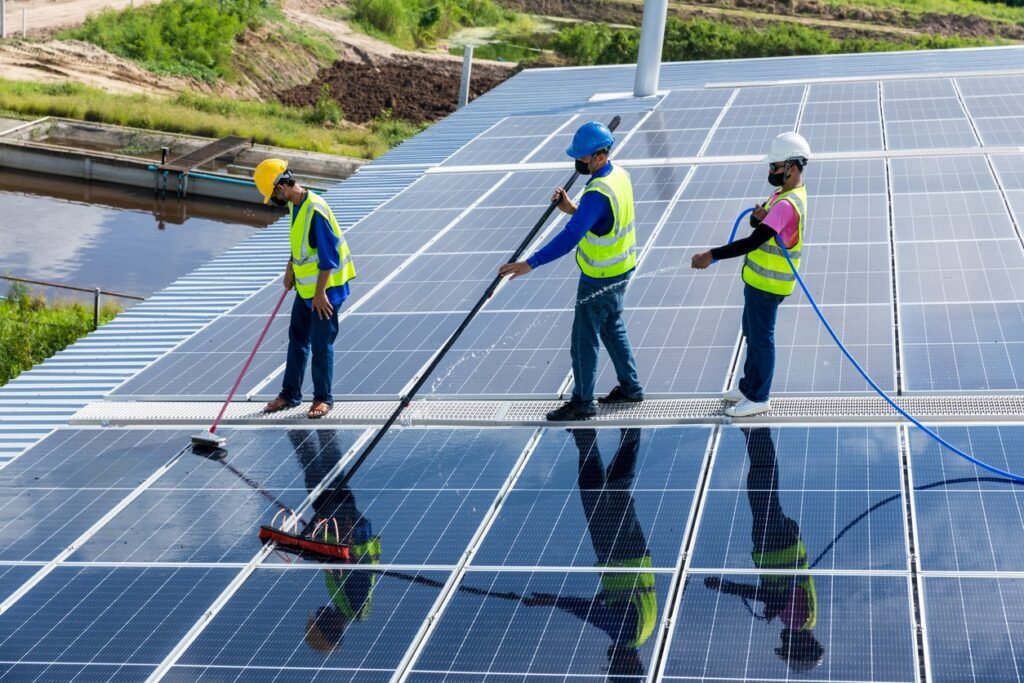 workers-cleaning-solar-panels-on-rooftop